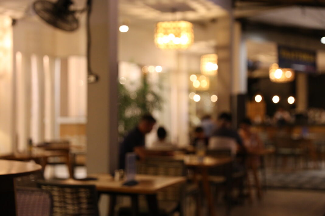 Blurred background of restaurant with abstract bokeh light.